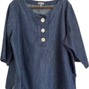 Denim cropped top with white buttons.